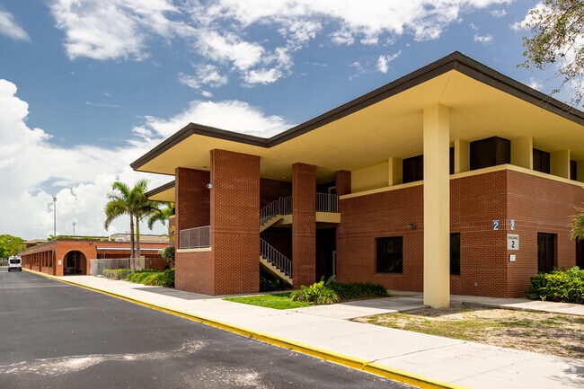 Naples High School features multiple buildings and designated a pick-up and drop-off area.