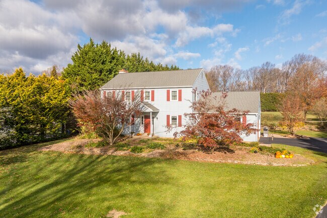 Colonial homes line the quiet streets of New London Township, showcasing timeless design.