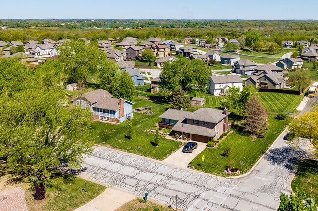 Homes in I-435 West KC-KS often feature spacious front yards and suburban landscaping.