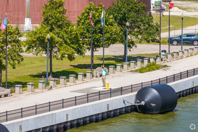 A man enjoys taking photos at Leicht Memorial Park near the Olde Norwood neighborhood.