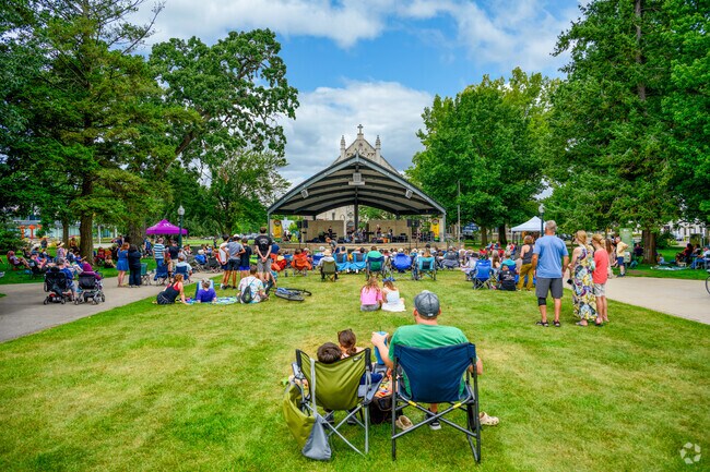An audience enjoys a Concert in the Park at Bronson Park in the Central Business District.