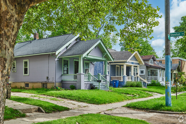 A row of colorful Craftsman bungalows is set just walking distance from Yost Ice Arena.