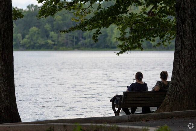 Friends in Burke enjoy an afternoon by the scenic Burke lake.