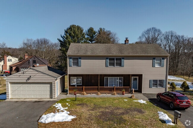 A modified home with a detached garage on Benz Street in Ansonia.
