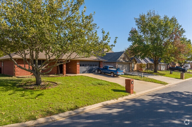 Traditional ranch homes sit along tree lined streets in Aubrey TX.