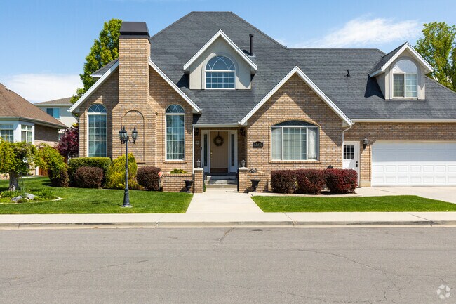 A stunning Orem South residence has a grand façade that exudes elegance and sophistication