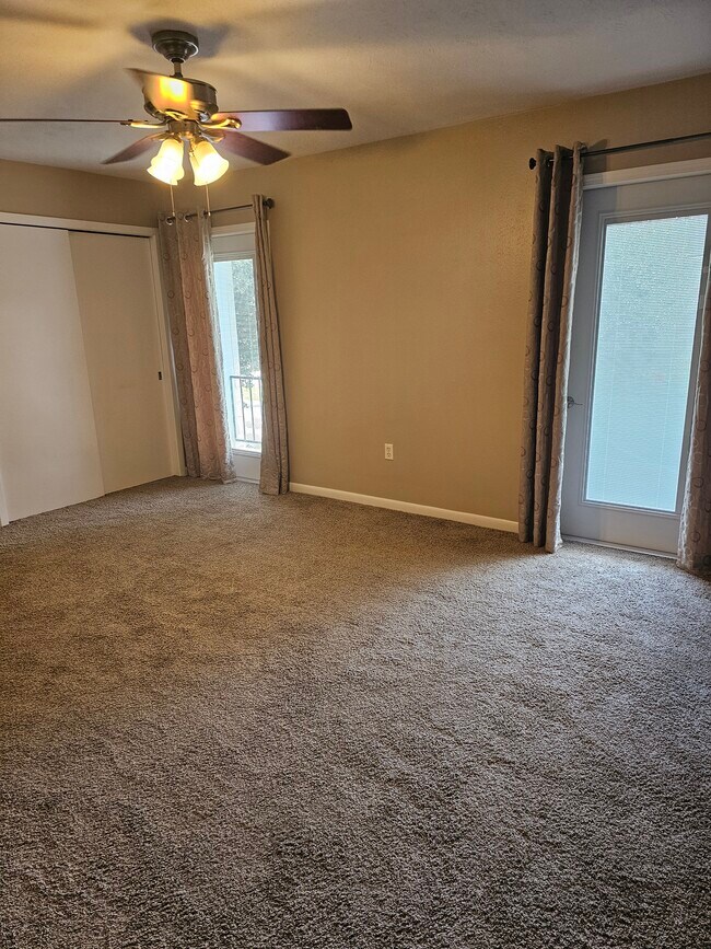 Primary bedroom view towards balcony