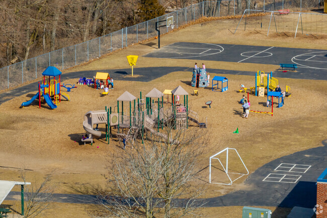 Columbia Elementary School features a large play area behind the school for student recess.