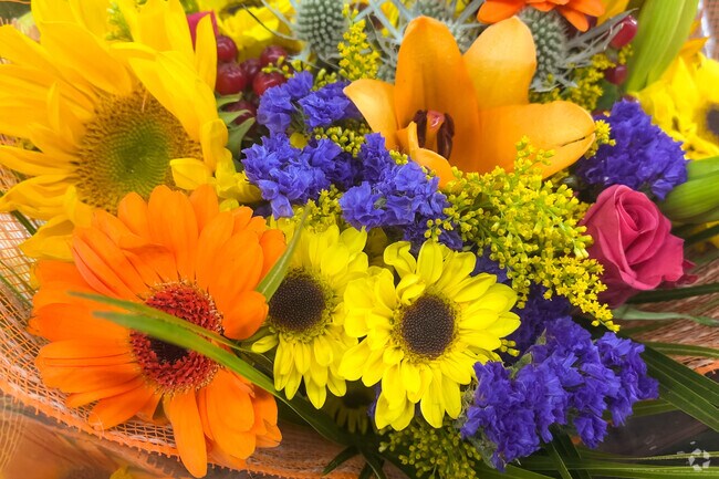 Retailers in Creekside have colorful flowers and products for residents.