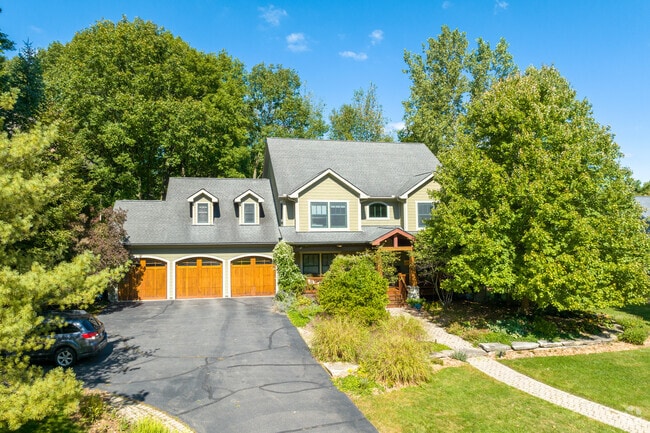 Barton Plateau & Huron River Heights homes are surrounded by trees.