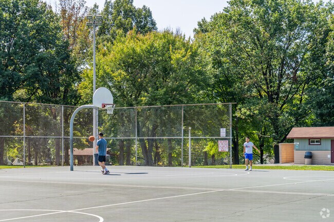Locals enjoy the basketball courts at South Hills Park.