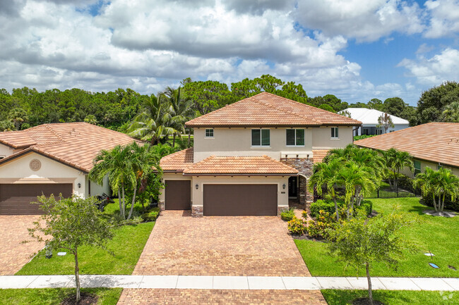 Mediterranean home with 2 car garage in Limestone Creek neighborhood.