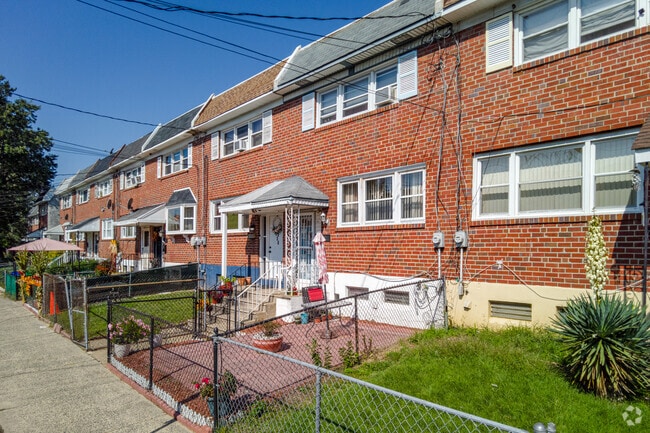 Many brick row homes in Morgan Village have modest yards.