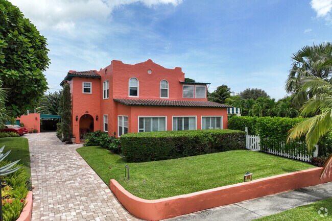 Colorful mission revival home with large front yard in Grandview Heights neighborhood.