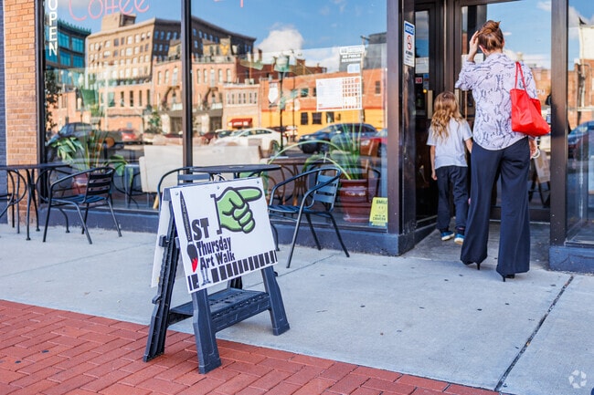 Grand View residents check out the local art scene during the First Thursday ArtWalk in downtown Joplin.