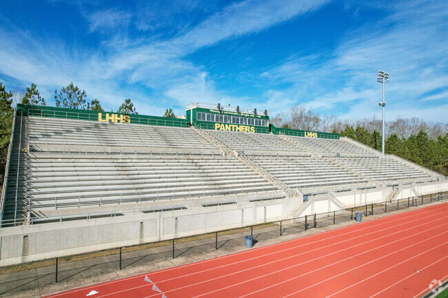 Langston Hughes High School home bleachers put the visitors side to shame.