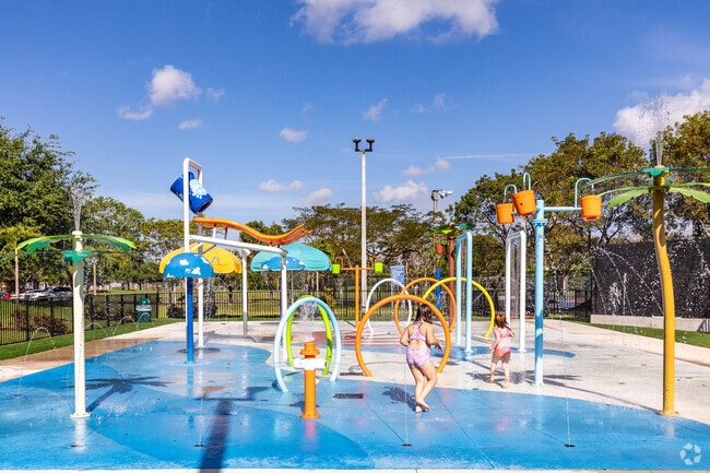 Children cool off at the splash playground in Betti Stradling Memorial Park.