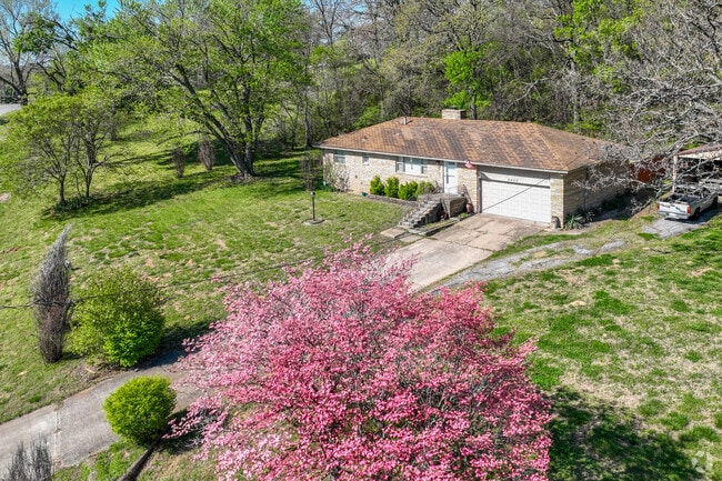 Humble ranch homes with sweeping lots can be found along the edges of Charles Page neighborhood.
