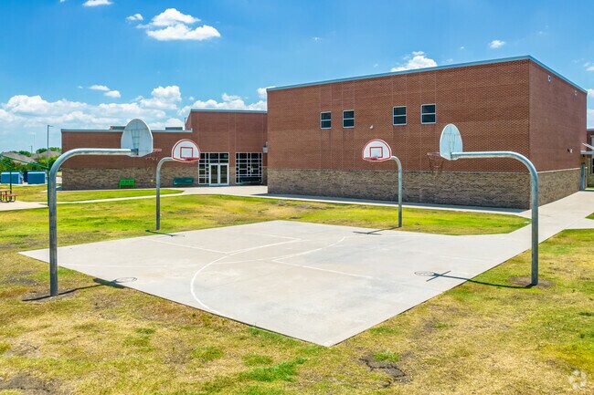 Students practice teamwork on the basketball court at Savannah Elementary School.