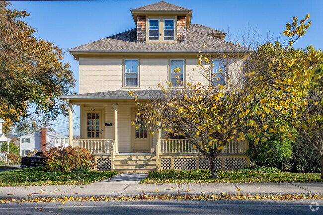 Explore the charm of the multifamily Foursquare home style in Somerset Historic Village, MA.