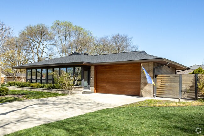 Contemporary Ranch-Style Homes With Floor to Ceiling Glass Wall at the Entrance Located in Springdale.