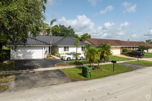 A row of well-manicured ranch homes in Rainbow Lakes.