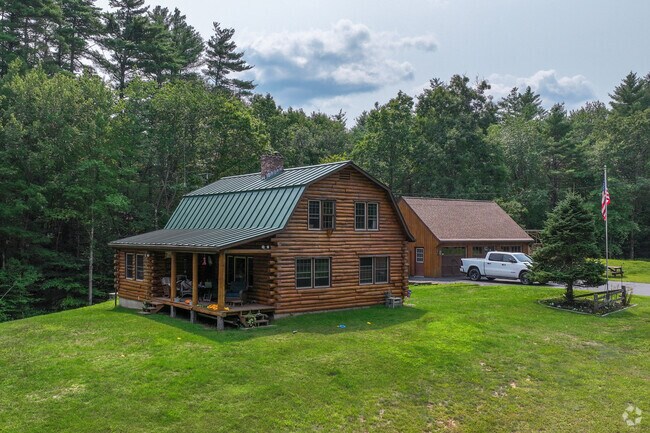 Log cabins add to the rustic feel of the Webster background.