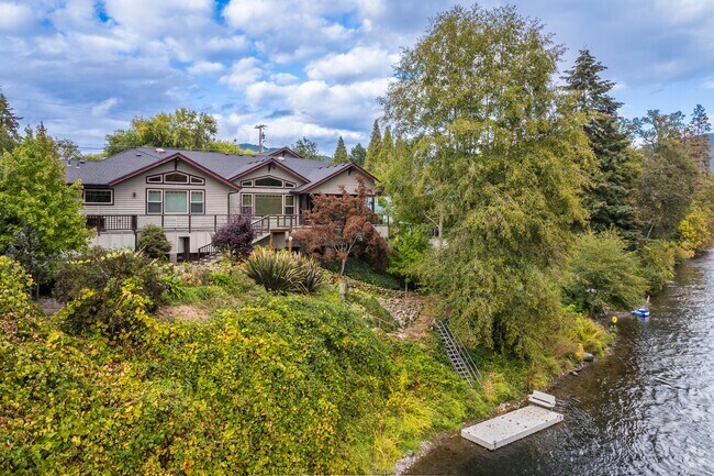 Single family homes along the Rogue River in Fruitdale have backyard river access.