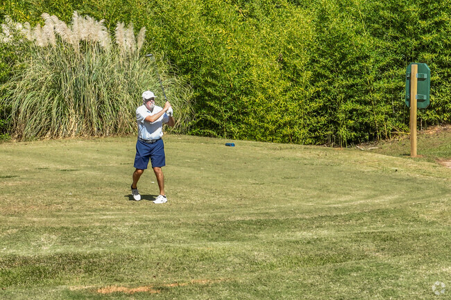 Evergreen Plantation residents golf during the day at Lake Jonesco Golf Course.