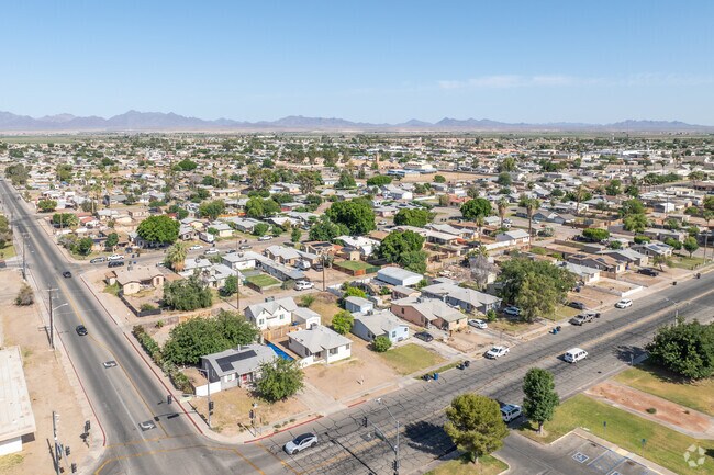 Blythe shows diverse architectural styles like Spanish, ranch, and modern Mediterranean homes.