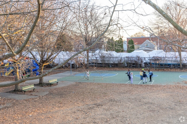 Kids play on the court at the Charles R. Curtis Memorial Park in Salem, MA.