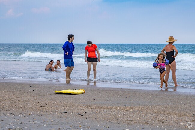 A family from Masonboro Forest enjoys a day at Wrightsville Beach.