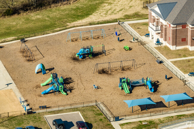 The Creekside Elementary School playground is popular during recess.