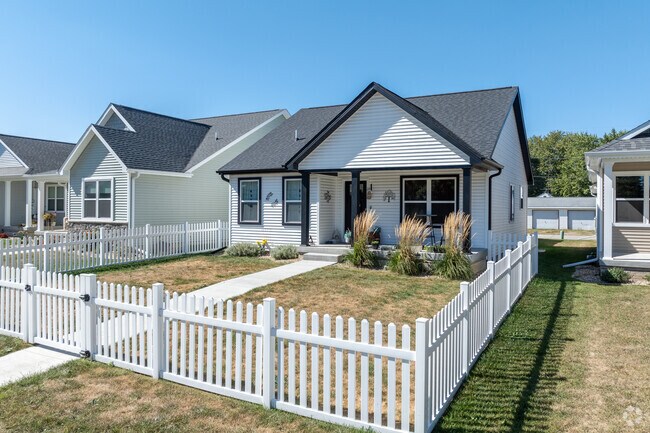 This new construction boast a clean look with dark trim and a nice picket fence.