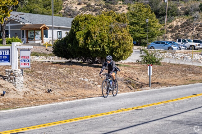 A bicyclist rides down Lake Elizabeth Road in Lake Hughes.