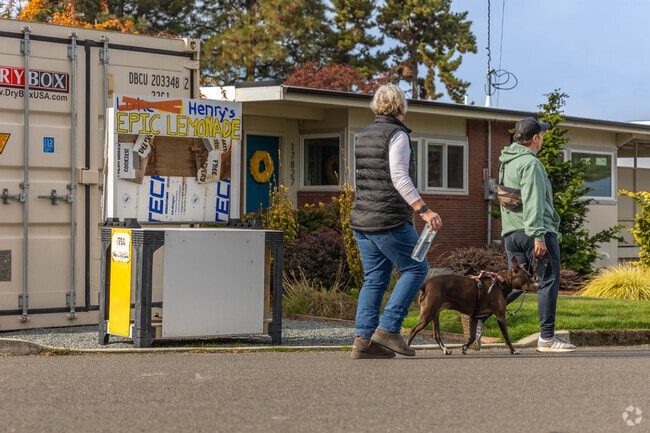 Folks in Manhattan can often be found strolling through the comfortable streets with their dog.