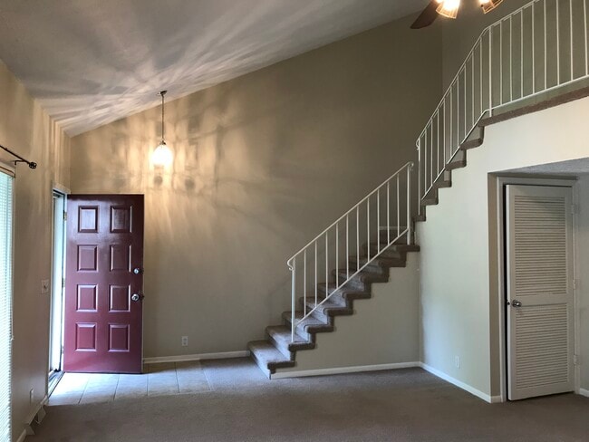 Neat vaulted ceiling in living room that makes an amazing statement when you walk into this nice townhome