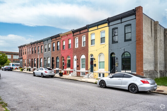 Colorful row homes line the streets, adding vibrancy to the area.