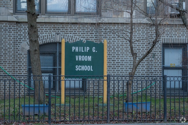 The school color of the Philip G. Vroom School is green.