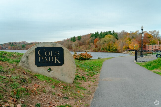 Coes Park welcomes their visitors to walk along Coes Pond.