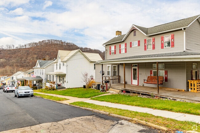 This farmhouse style home in Apollo includes a huge front porch for relaxing.