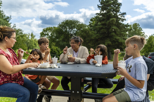 Locals from the Mound neighborhood enjoy ice cream on a hot summer day.