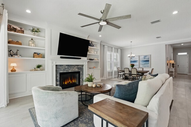 Open Living Room with fireplace and custom built-ins