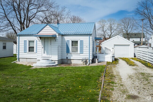 This home in Forest Park features a detached garage.
