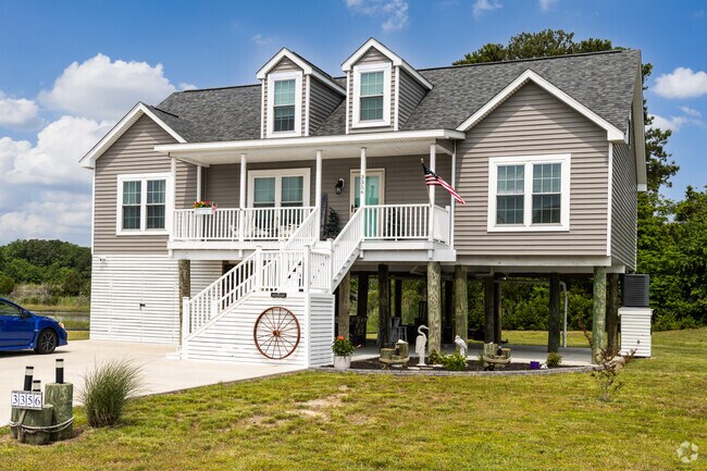 Waterfront homes in Captain's Cove offer private boat slips and serene bay views for residents.