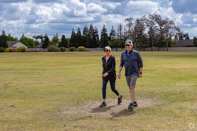A Fairway Oaks couple take in a brisk morning walk around the nearby Liberty Park.