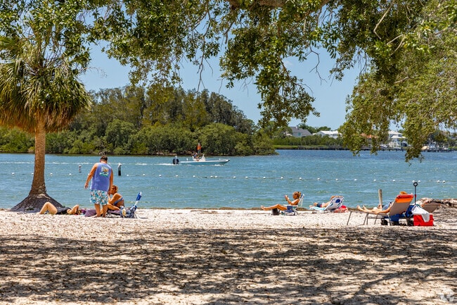 Sun on the beach as you watch the boats pass by on the Anclote River near Holiday .