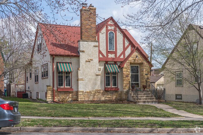 A tudor style house with red accents is an example of the many classic houses styles in Hale.