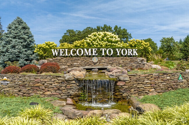 Pristine landscaping paired with a rock waterfall welcomes visitors and residents to Southwest York.