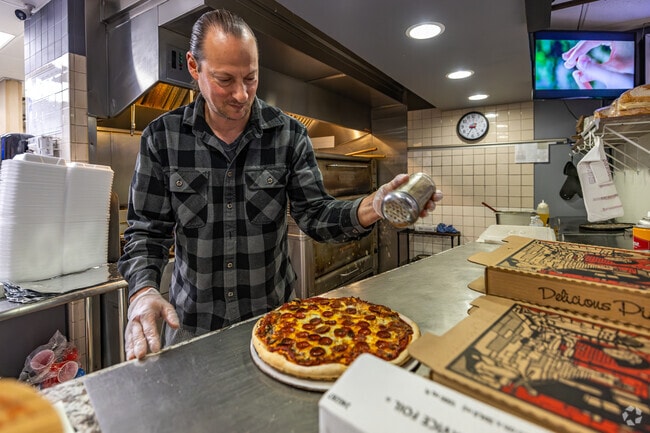 Tim, the owner of Alphonso's in LaFollette Park,makes sure each pie is perfectly delicious.